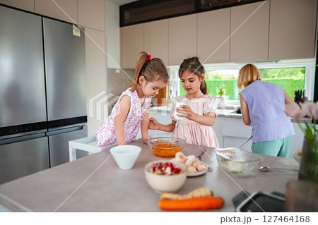 Baking fun with kids in a sunny kitchen afternoon 127464168