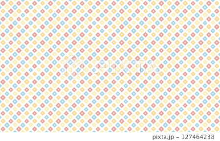 レトロな黄色と青と赤の鹿の子模様がランダムに並ぶ背景素材 127464238