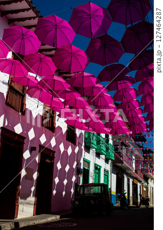 Colorful umbrellas and the beautiful streets of the Heritage Town of Jerico located in the Department of Antioquia in Colombia. Colorful umbrellas and the beautiful streets of the Heritage Town of Jerico located in the Department of Antioquia in Colombia. 127464287