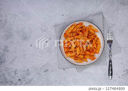 Pasta spaghetti Bolognese with red tomato souse on white plate on isolated white background. 127464800