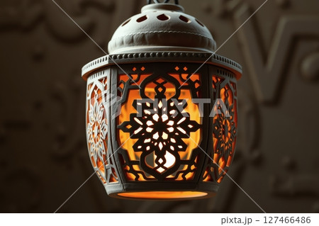 Intricate illuminated lantern with beautiful design details and warm interior lighting 127466486