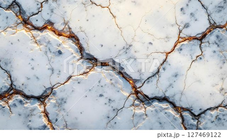 Detailed image of a rock wall highlighting various cracks and fissures in the rugged stone Detailed image of a rock wall highlighting various cracks and fissures in the rugged stone 127469122