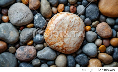 Close-up image of a substantial pile of rocks, emphasizing their unique shapes and natural colors 127469389
