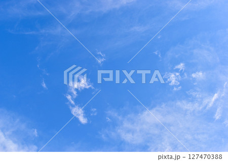 beautiful blue sky and white fluffy group of clouds with sunrise in the morning, natural background 127470388