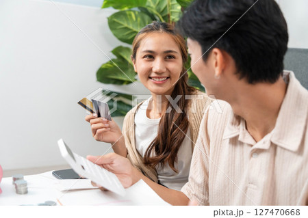 Financial Planning and Budgeting. Couple discussing expenses and managing finances at home. Financial Planning and Budgeting. Couple discussing expenses and managing finances at home. 127470668