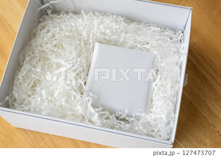 Eco friendly white paper wrap for product packaging parcel carton box Eco friendly white paper wrap for product packaging parcel carton box 127473707