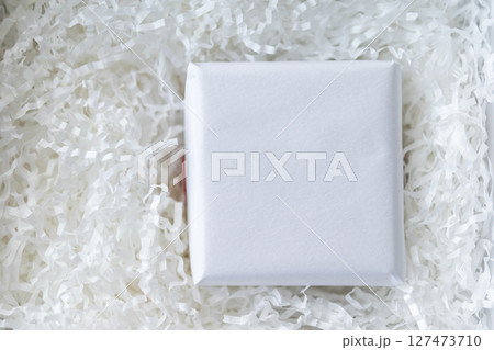 Eco friendly white paper wrap for product packaging parcel carton box 127473710
