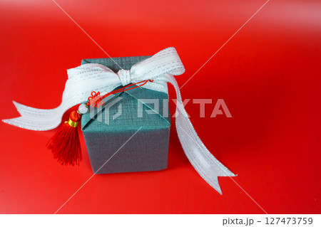 minimal flat lay chinese new year decoration item and gift box on red background minimal flat lay chinese new year decoration item and gift box on red background 127473759