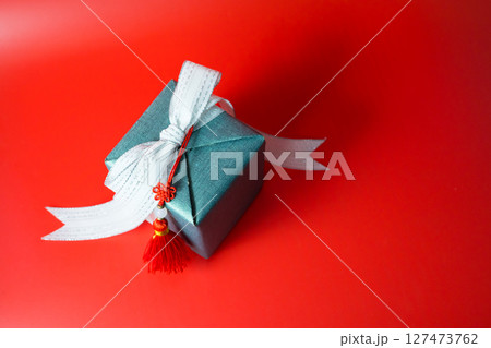 minimal flat lay chinese new year decoration item and gift box on red background minimal flat lay chinese new year decoration item and gift box on red background 127473762