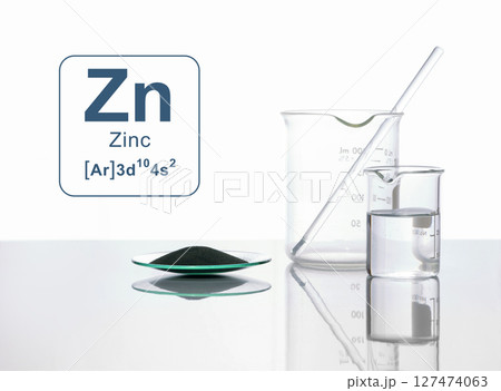 Close up chemical ingredient on white laboratory table. Zinc Powder in Chemical Watch Glass with Symbol, Name and Electron Configuration. 127474063
