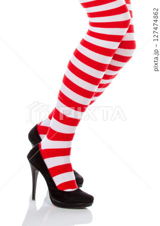 Woman with long legs and stockings over isolated background Woman with long legs and stockings over isolated background 127474862