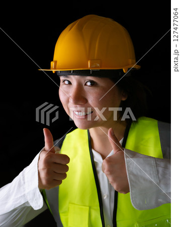 factory woman workers or technicians civil Engineer or Architecture project management give thumb up. factory woman workers or technicians civil Engineer or Architecture project management give thumb up. 127477064