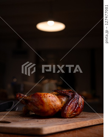 Juicy Rotisserie Chicken Ready to Serve. 127477081