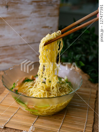 egg noodles with wonton roasted pork and crispy pork. 127477391
