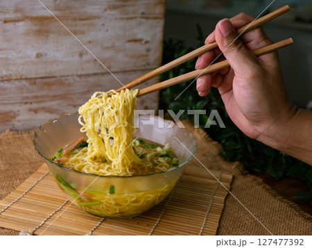 egg noodles with wonton roasted pork and crispy pork. 127477392