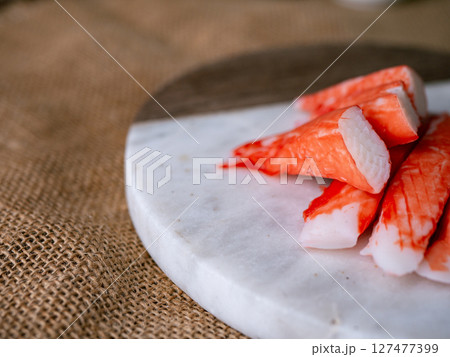 Fresh crab sticks surimi set on white plate with wasibi. Fresh crab sticks surimi set on white plate with wasibi. 127477399