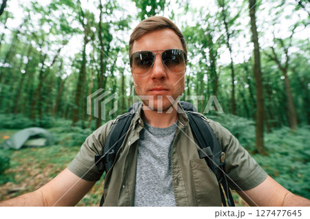Selfie of tourist that is in summer forest. Conception of exploration and leisure 127477645