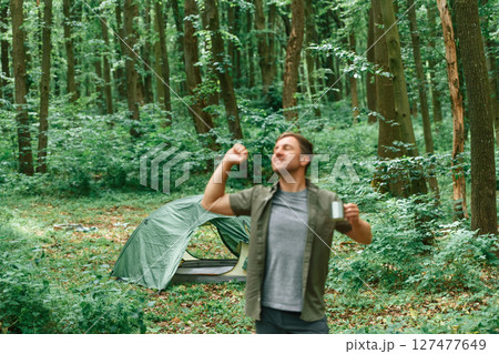 Just woke up, good morning. Tourist in summer forest. Conception of exploration and leisure Just woke up, good morning. Tourist in summer forest. Conception of exploration and leisure 127477649