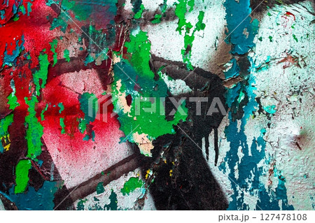 Grunge Peeling Paint Texture in Bold Red, Green, and Blue with Vintage 80s Urban Aesthetic 127478108