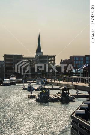 Modern seaport terminal with blue water under clear sky, industrial harbor view. High quality photo Modern seaport terminal with blue water under clear sky, industrial harbor view. High quality photo 127478185