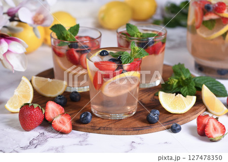 Lemonade with strawberries, blueberries and mint Lemonade with strawberries, blueberries and mint 127478350
