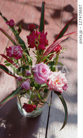 Pink and Red Roses in a Glass Vase 127478687