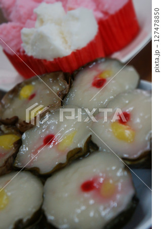 Sweet cake prepared and made from glutinous rice and consumed in Chinese new year cuisine 127478850