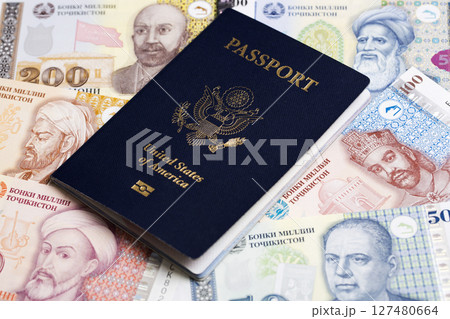 American passport onTajikistani Somoni American passport onTajikistani Somoni 127480664