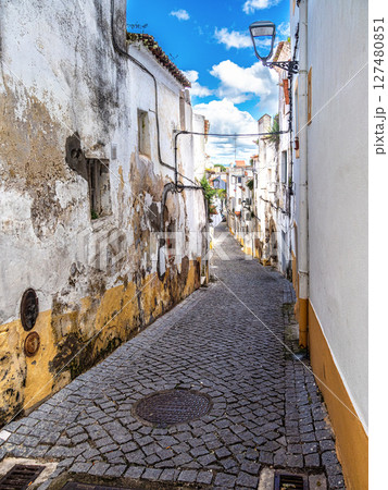 Typical Portuguese facades and cobblestone streets in Elvas, Portugal. Typical Portuguese facades and cobblestone streets in Elvas, Portugal. 127480851