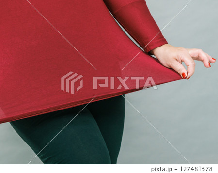 Woman plus size in red tunic 127481378