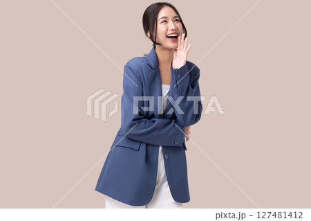 Portrait of happy young business woman posing open mouth isolated on brown background. Portrait of happy young business woman posing open mouth isolated on brown background. 127481412