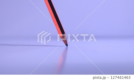 red pencil on white wood table 127481463
