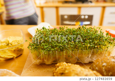 Baguette and cuckooflower on kitchen table Baguette and cuckooflower on kitchen table 127481659