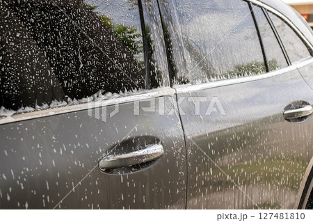 car cleaning and washing with foam soap 127481810