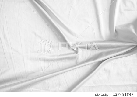 Abstract white wrinkled bedding sheet fabric texture background 127481847