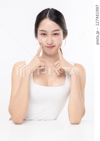 Beauty portrait of happy Asian female face with natural skin make up isolated on white background. 127481997