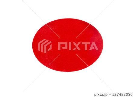 Red oval shape paper sticker isolated on white background Red oval shape paper sticker isolated on white background 127482050