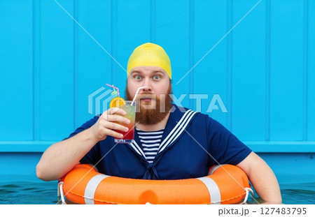 Surprised Swimmer With Summer Drink Surprised Swimmer With Summer Drink 127483795