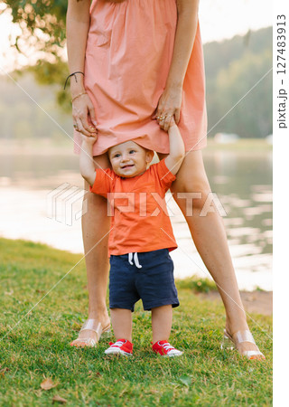 Smiling Toddler Holding Parent Hands Smiling Toddler Holding Parent Hands 127483913