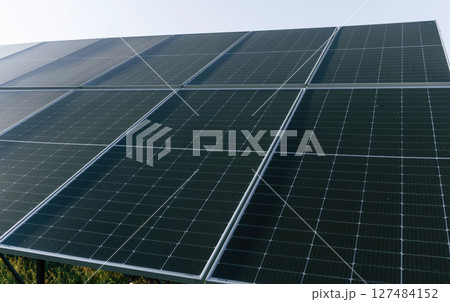 At sunny daytime. Close-up view of solar cell farm power plant eco technology 127484152