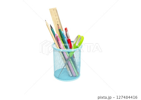 School and office supplies, pens, pencils, ruler, compass in a metal cup on a white background. School and office supplies, pens, pencils, ruler, compass in a metal cup on a white background. 127484416