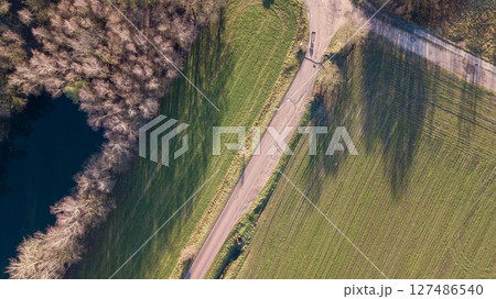 An Aerial View showcasing the Scenic Path winding through a Beautiful Natural Landscape 127486540