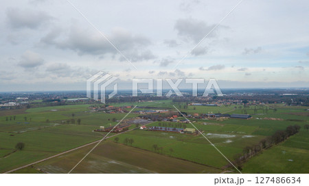 Stunning Aerial View of the Scenic Dutch Countryside Beneath Beautiful Cloudy Skies Stunning Aerial View of the Scenic Dutch Countryside Beneath Beautiful Cloudy Skies 127486634