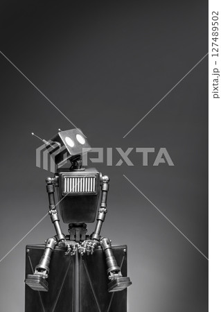 Humanoid robot on a dark background. Humanoid robot on a dark background. 127489502
