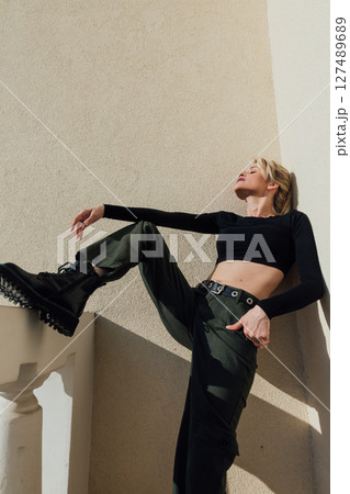 Beautiful fashionable blonde in military clothes Beautiful fashionable blonde in military clothes 127489689