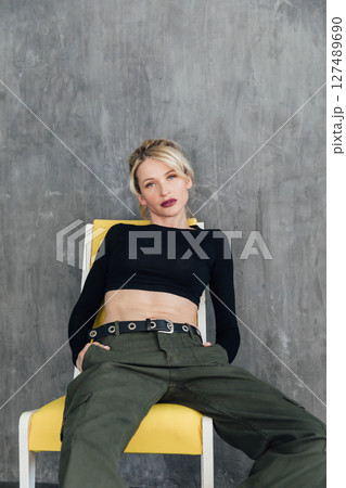Beautiful fashionable blonde in military clothes Beautiful fashionable blonde in military clothes 127489690