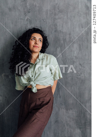 Portrait of a beautiful brunette woman in summer clothes 127489713