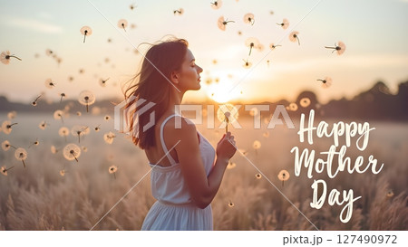 Beautiful Woman with Dandelion Wishes Happy Mother's Day in a Serene Meadow 127490972