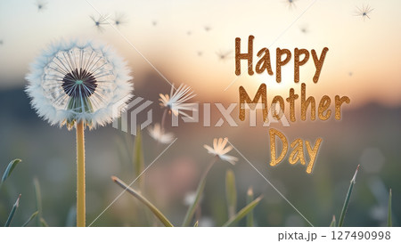 Dandelion Seed Head with Golden Mother's Day Greeting Against a Sunset Backdrop 127490998