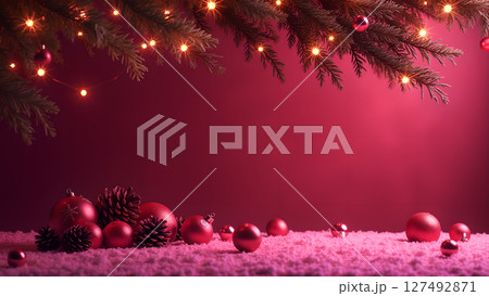 Festive christmas background with red ornaments and pine branch with light Festive christmas background with red ornaments and pine branch with light 127492871